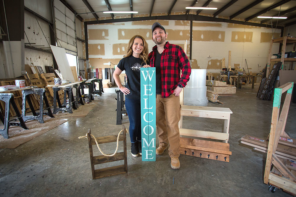 FROM SCRATCH: Aaron Black, right, and wife Jennifer sell welcome signs and wooden decor on eight online marketplaces, soon to be adding Wayfair.com.